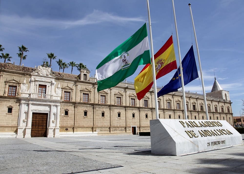 The Andalusian Parlament, a goverment building whose try to protect Andalusian culture. It has Andalusia, Spain and Europe flags in front.
