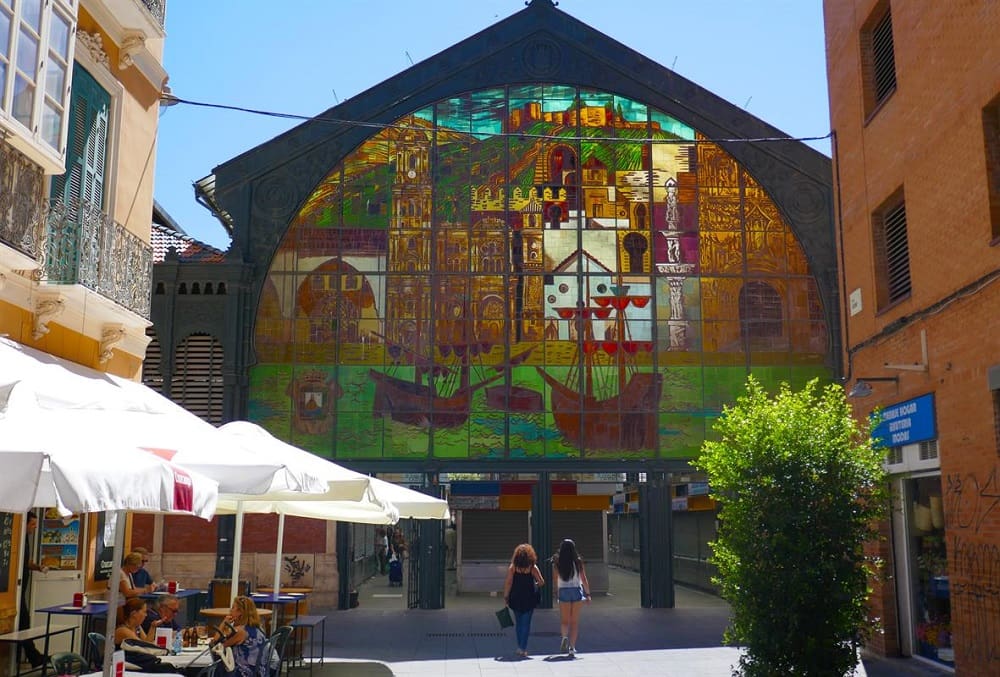 The bustling Mercado Central de Atarazanas, a market located in a 19th-century building with stunning iron architecture and a stained glass window. Hidden in the Historic Center