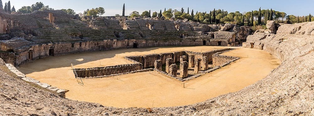 Itálica, ancient Roman ruins located near Sevilla, showcasing remnants of amphitheaters, mosaics, and streets, reflecting the grandeur and significance of one of the earliest Roman settlements in Spain